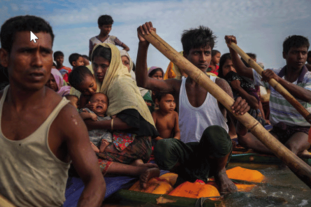 Rohingya refugees cross the Naf River with an improvised raft to reach to Bangladesh in Teknaf, Bangladesh (Part of Reuters series that won Pulitzer for feature photography)