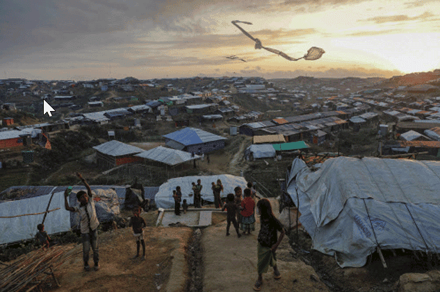 Rohingya refugee children fly improvised kites at the Kutupalong refugee camp near Cox's Bazar, Bangladesh (Part of Reuters series that won Pulitzer for feature photography)