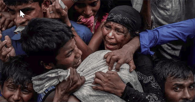 Rohingya refugees scramble for aid at a camp in Cox's Bazar, Bangladesh (Part of Reuters series that won Pulitzer for feature photography)
